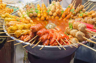 High angle view of skewer food in bowl at table