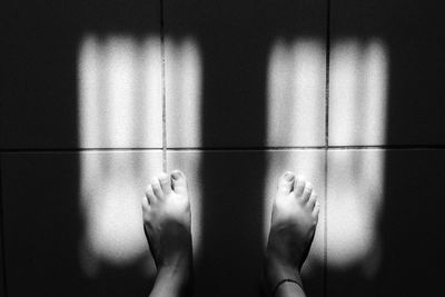 Close-up of woman standing on floor