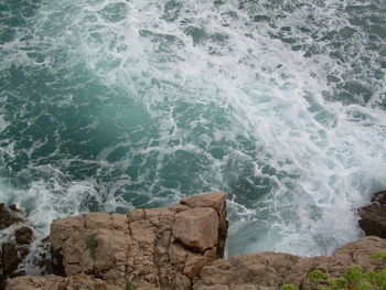 Waves splashing on rocks