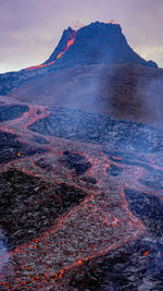 Scenic view of volcanic mountain against sky