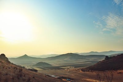 Scenic view of landscape against sky during sunset