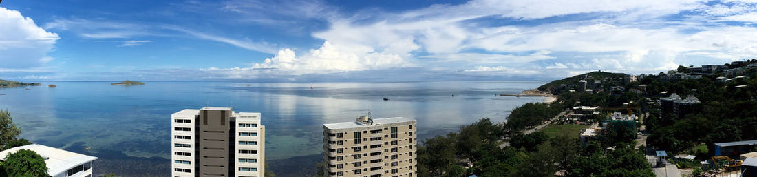 Panoramic view of sea and buildings in city