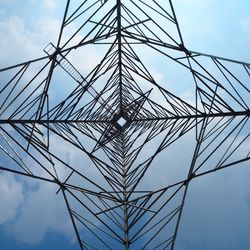 Low angle view of electricity pylon against sky