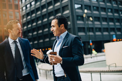 Men standing in front of office building