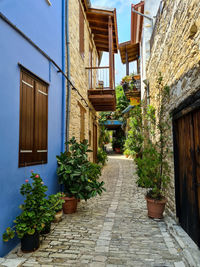 Narrow alley amidst buildings in mediterranean village