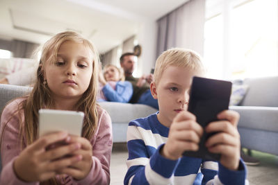 Mother and daughter using smart phone