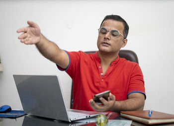 Young man using laptop on table