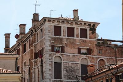 Low angle view of old building against sky