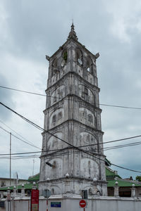 Low angle view of clock tower against sky