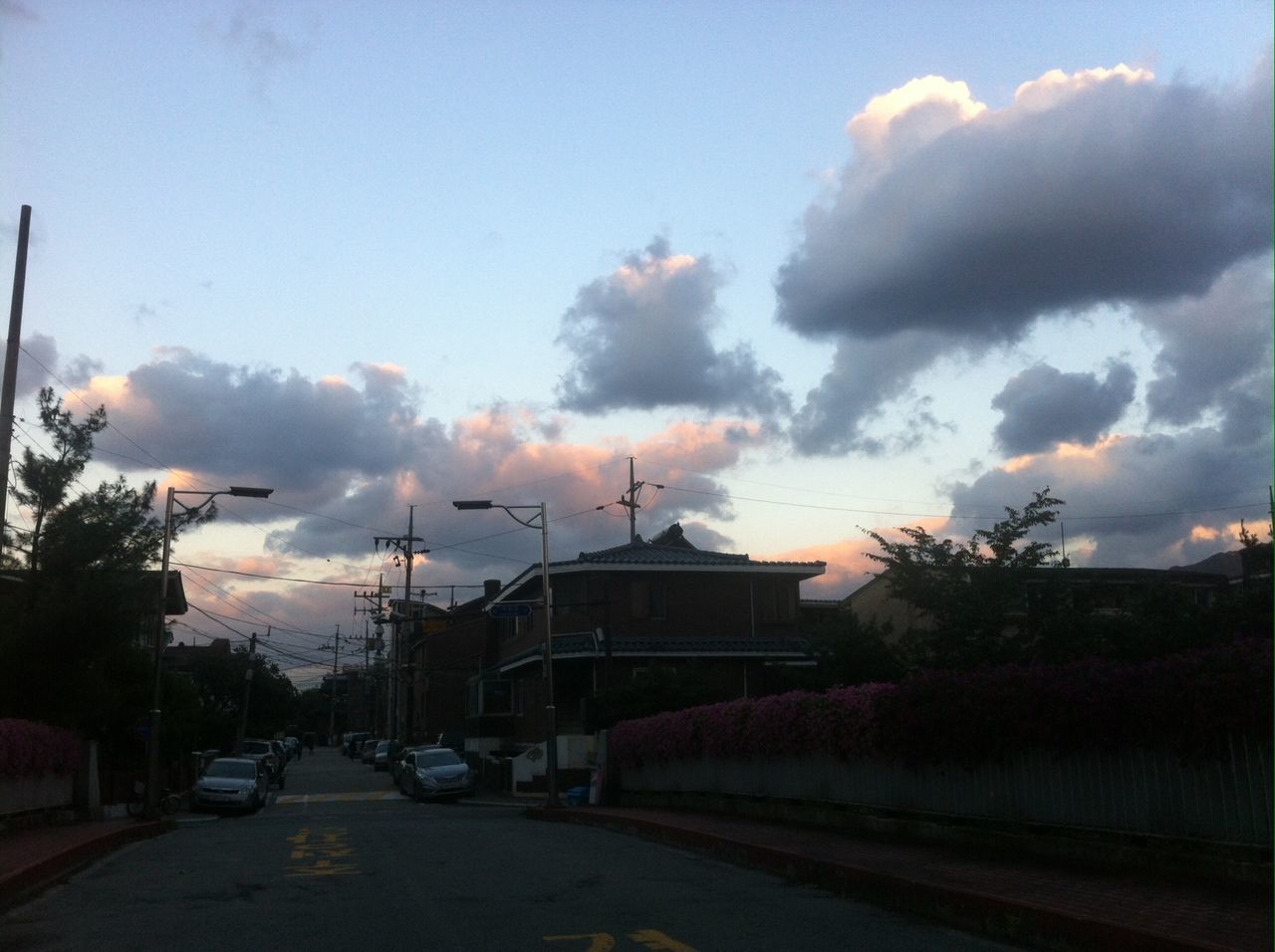 transportation, land vehicle, car, mode of transport, sky, cloud - sky, road, street, building exterior, sunset, architecture, built structure, cloudy, cloud, on the move, tree, city, stationary, the way forward, parking