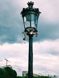 Low angle view of street light against sky