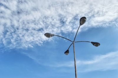 Low angle view of street light against sky