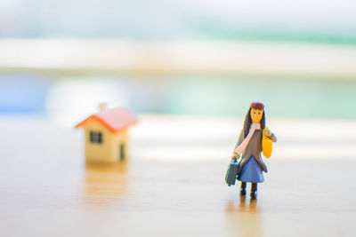 Close-up of figurines on wooden table