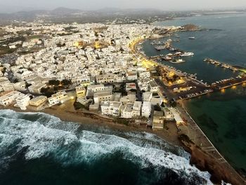 Aerial view of sea and cityscape