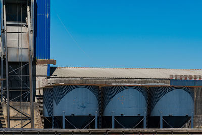 Low angle view of building against clear blue sky