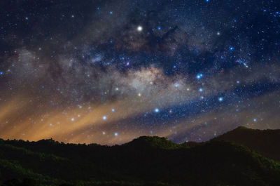 Scenic view of star field against sky at night