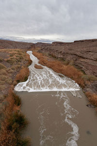 Scenic view of river flowing through the desert landscape