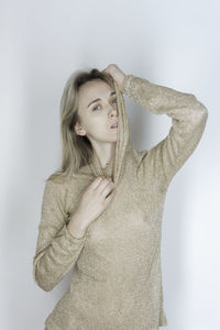 Portrait of a beautiful young woman over white background