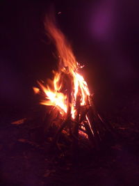 Close-up of bonfire against sky at night