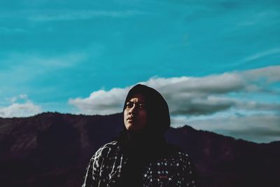 Portrait of women looking away against sky