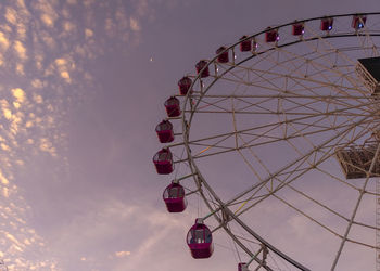 Low angle view of ferris wheel against sky