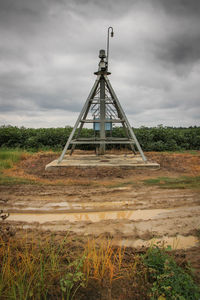 Built structure on field against sky