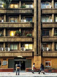 People walking on residential building