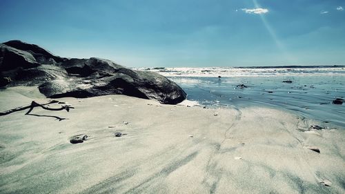 Scenic view of beach against sky