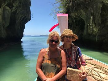 Portrait of mature women on longboat in sea