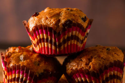 Freshly baked homemade muffins with raisins and carrots. vegetarian pastries on a wooden background. 