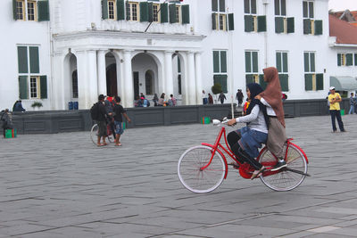 People on bicycle in city