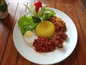 Tumpeng rice made from coconut milk and turmeric for birthdays.