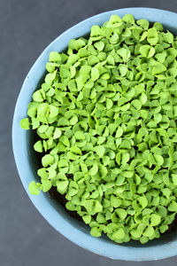 High angle view of chopped fruits in bowl on table