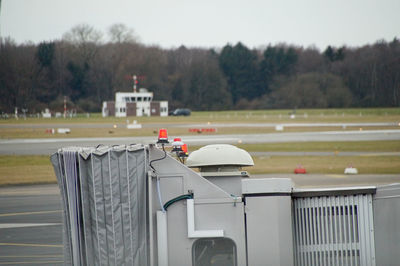 Cropped image of passenger boarding bridge at runway