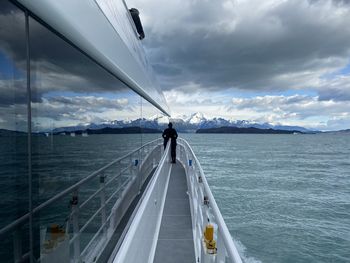 Man looking at sea against sky