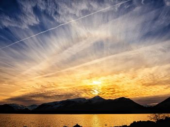 Scenic view of silhouette mountains against sky during sunset