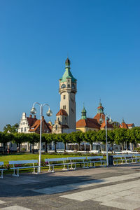 View of buildings against blue sky