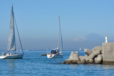 Boats sailing in sea