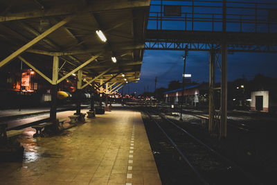 Railroad station platform at night