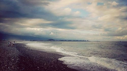 Scenic view of sea against cloudy sky