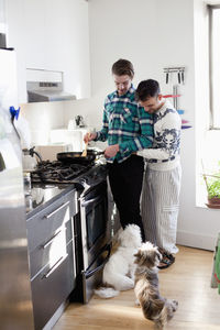 People with dog at home