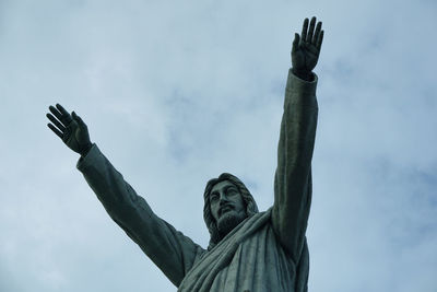 Low angle view of statue against sky