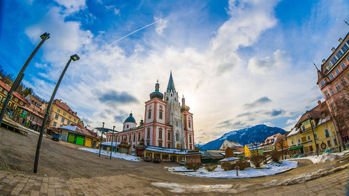 Low angle view of buildings against sky in city