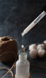 Organic homemade cosmetics concept. skincare serum on dark background. selective focus, close-up.