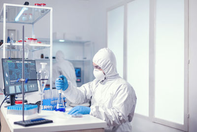 Scientist examining chemical in laboratory