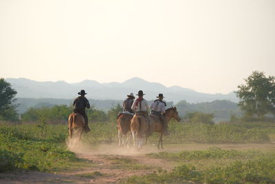 People riding horses