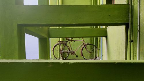 Bicycle against wall in building