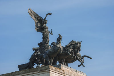 Low angle view of statue against sky