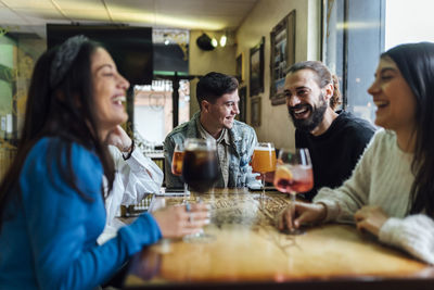 Group of people drinking glass on table