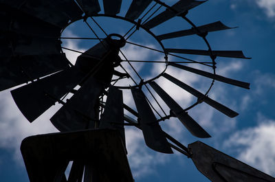 Low angle view of wind turbine against sky